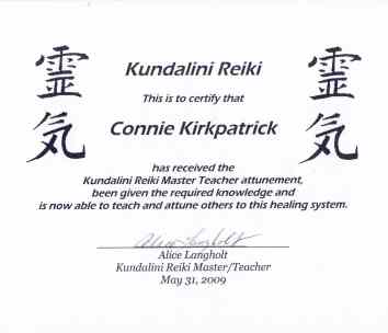 Certificate with Japanese characters, English text, signature, and date, certifying Reiki mastery achievement.
