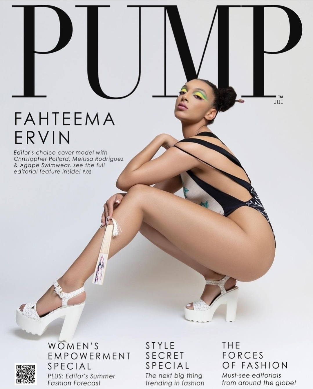 Woman in black strappy outfit and white platform shoes crouches with arms crossed, looking upward, on magazine cover.
