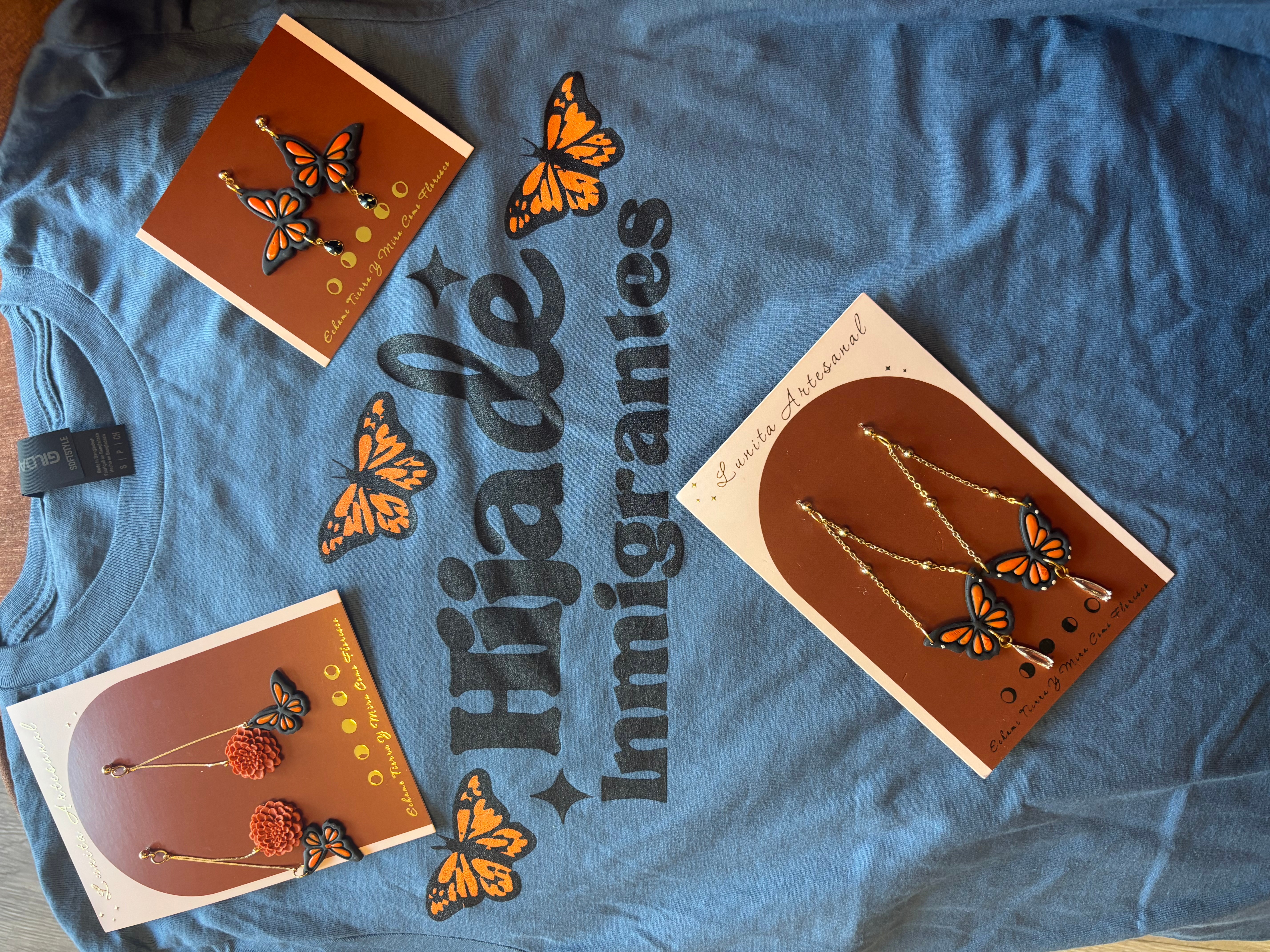 Blue Trixie Imigames T-shirt with butterfly jewelry and butterfly images, two jewelry boxes with butterfly earrings, and butterfly illustrations.