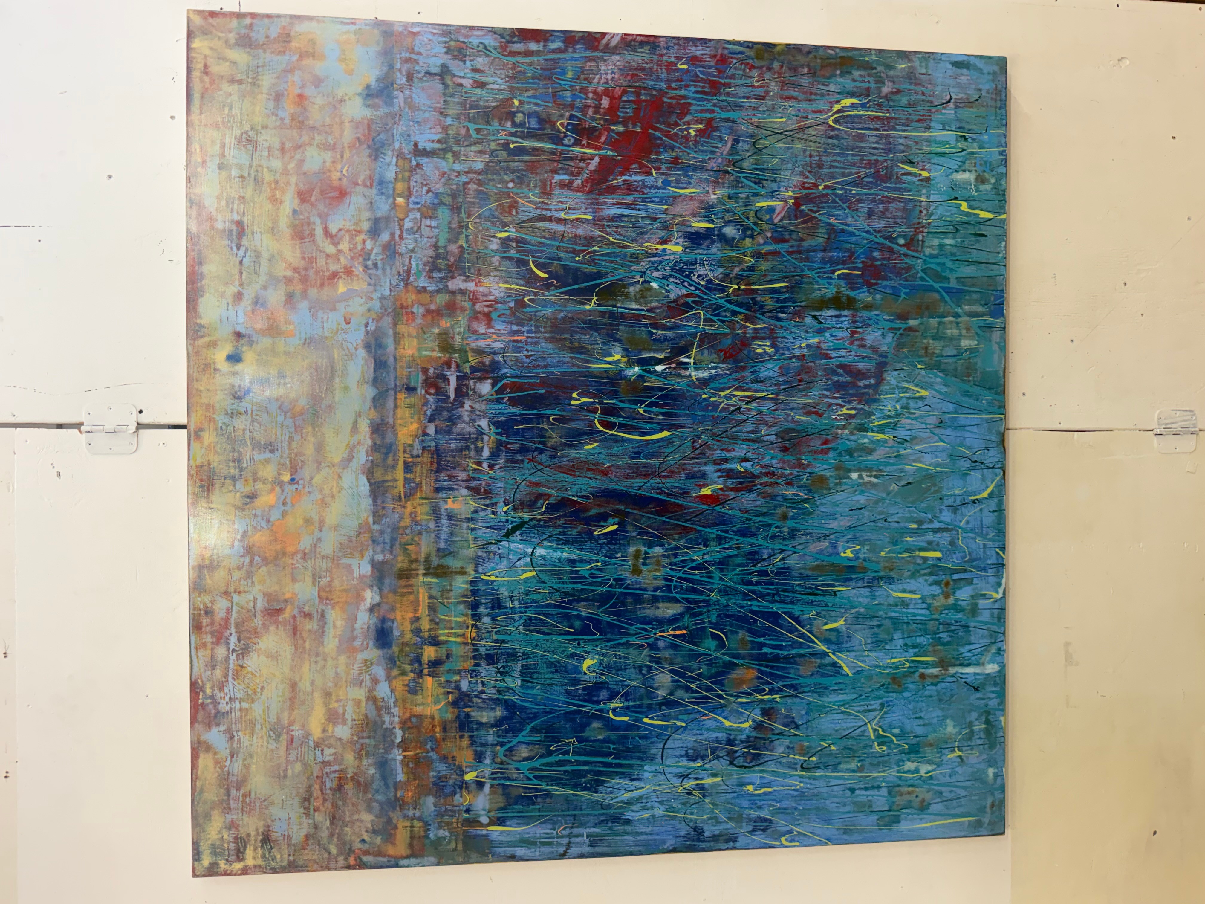 Abstract painting with blue, red, and yellow colors, textured surface, and vertical orientation.