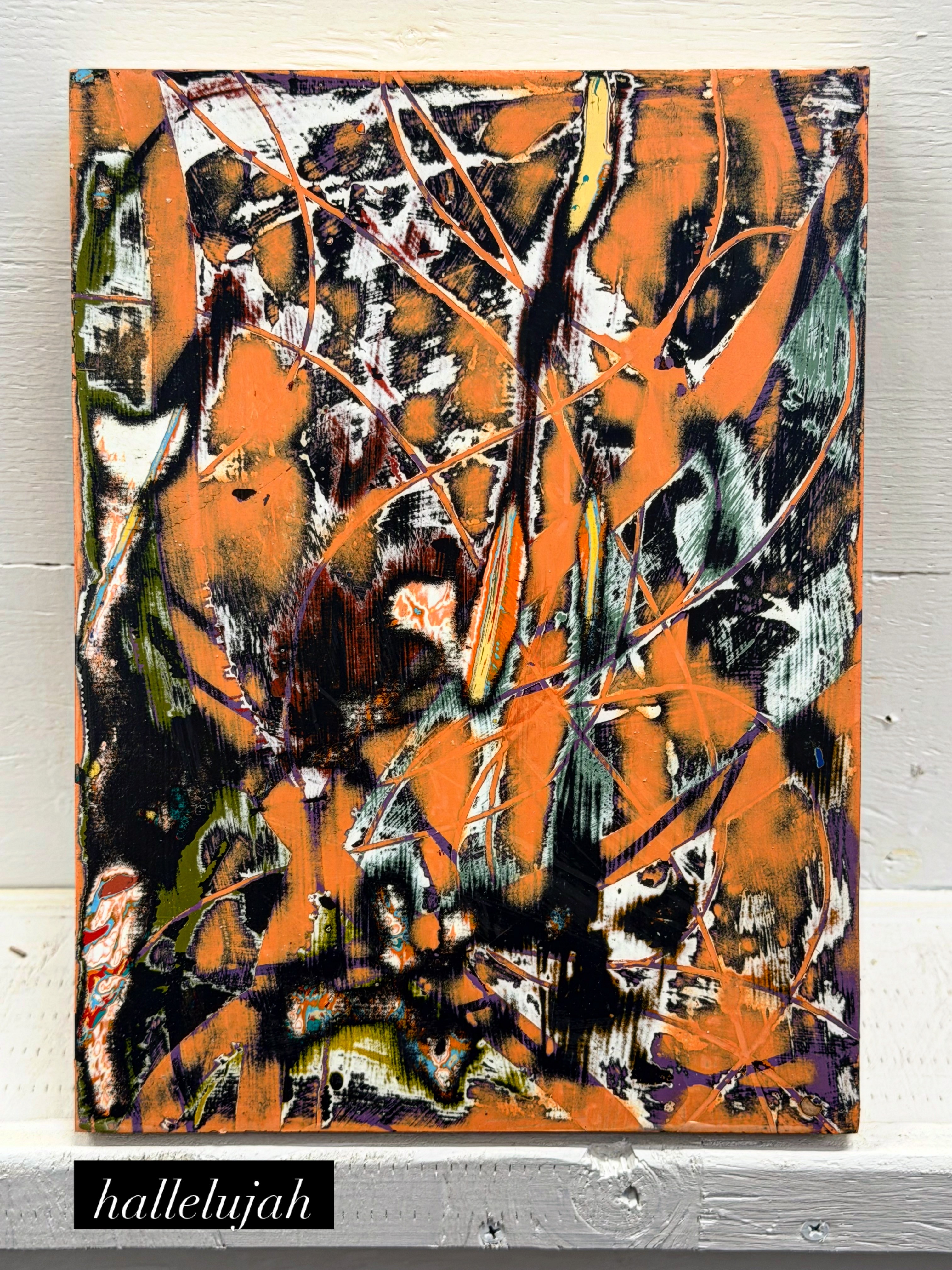 Abstract painting with orange, black, white, and green colors, featuring chaotic lines and shapes.